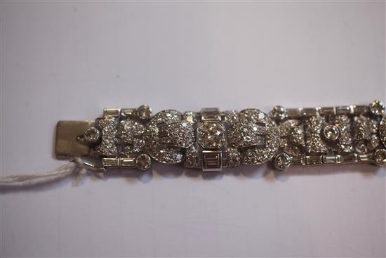 An attractive 1930s/1940s Art Deco white gold and diamond encrusted bracelet in Jays of London fitted box, 7in.